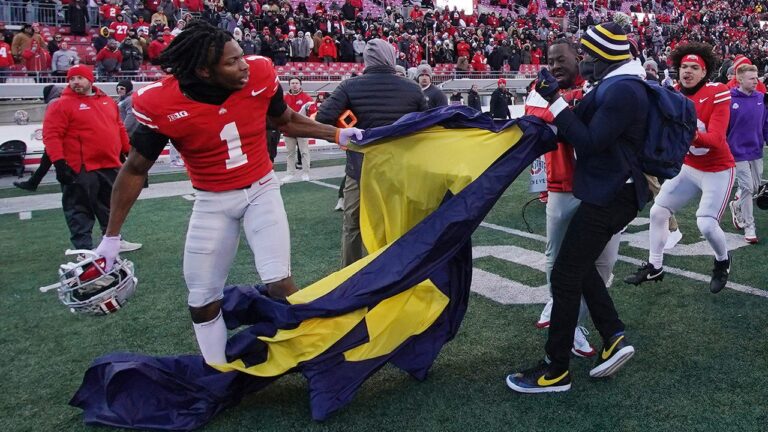 Michigan's shocking upset over Ohio State erupts into chaos as massive brawl at midfield breaks out