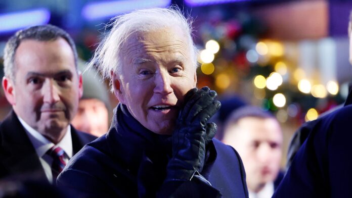 Biden attends national Christmas tree lighting on windy Washington night