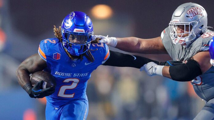 Heisman hopeful Ashton Jeanty points to his faith after playoff-bound Boise State wins Mountain West title